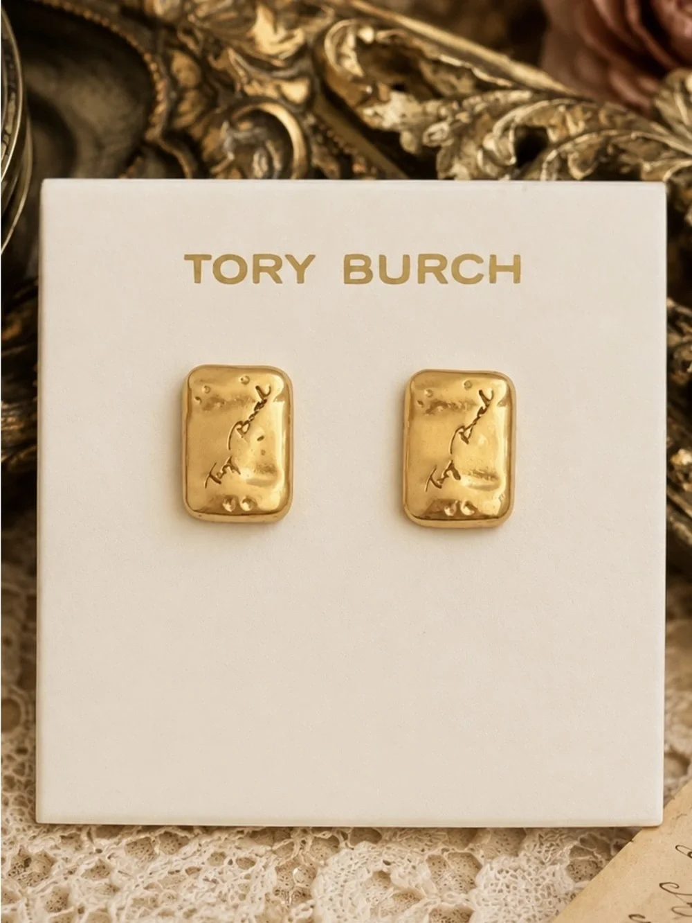 TORY BURCH • Gold Torsade Signature Luggage Tag Nugget Logo Plaque Earrings
